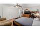 Primary bedroom featuring hardwood floors, a ceiling fan and a large dresser at 1017 S San Jose Cir, Mesa, AZ 85202