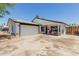 Charming single-story home with a well-manicured lawn, covered front porch, and attached two car garage at 1017 S San Jose Cir, Mesa, AZ 85202