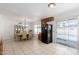 Spacious kitchen and dining room with a view of the backyard pool at 1017 S San Jose Cir, Mesa, AZ 85202