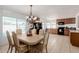 Open kitchen and dining room with views to the backyard pool at 1017 S San Jose Cir, Mesa, AZ 85202