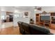 View of the living room with hardwood floors and a pass through to the kitchen at 1017 S San Jose Cir, Mesa, AZ 85202