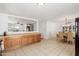 Open living space concept with a kitchen and dining room, featuring tile floors at 1017 S San Jose Cir, Mesa, AZ 85202