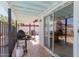 Covered patio with tile floor and sliding glass door leading into the home at 1017 S San Jose Cir, Mesa, AZ 85202