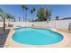 Backyard pool featuring a diving board, basketball hoop, and beautiful tile surround at 1017 S San Jose Cir, Mesa, AZ 85202