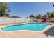 Backyard pool with diving board, basketball hoop, and a playset at 1017 S San Jose Cir, Mesa, AZ 85202