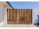 A wood side gate that provides privacy and access to the backyard at 1017 S San Jose Cir, Mesa, AZ 85202