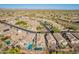 A wide-shot aerial view shows a pool community and mountain views in the distance at 10276 E Meandering Trail Ln, Gold Canyon, AZ 85118