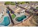 Scenic aerial view of a home with desert landscaping and a large private pool at 10276 E Meandering Trail Ln, Gold Canyon, AZ 85118