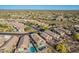 An aerial view shows pools and desert landscaping within this desert community at 10276 E Meandering Trail Ln, Gold Canyon, AZ 85118