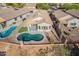House aerial view of backyard with pool and desert landscaping at 10276 E Meandering Trail Ln, Gold Canyon, AZ 85118