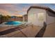 Backyard pool and covered patio with mountain views at 10276 E Meandering Trail Ln, Gold Canyon, AZ 85118