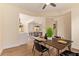 Dining room with views to the kitchen with wood floors and modern decor at 10276 E Meandering Trail Ln, Gold Canyon, AZ 85118
