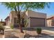 Charming single-story home featuring desert landscaping and a two-car garage at 10276 E Meandering Trail Ln, Gold Canyon, AZ 85118