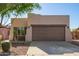 Charming single-story home featuring desert landscaping and a two-car garage at 10276 E Meandering Trail Ln, Gold Canyon, AZ 85118