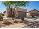 Charming single-story home featuring desert landscaping and a two-car garage at 10276 E Meandering Trail Ln, Gold Canyon, AZ 85118