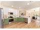 Spacious kitchen with stainless appliances, modern finishes, a breakfast bar, and views to the living space at 10276 E Meandering Trail Ln, Gold Canyon, AZ 85118