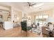 Bright living room with skylights, fireplace, and sliding glass doors with views of the backyard at 10276 E Meandering Trail Ln, Gold Canyon, AZ 85118
