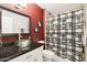 Bathroom featuring a sleek glass bowl sink, modern fixtures, and a stylish shower curtain at 10921 W Santa Fe Dr, Sun City, AZ 85351