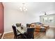 Open concept dining area featuring wood-look floors at 10921 W Santa Fe Dr, Sun City, AZ 85351