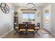 Charming dining area with stylish lighting and beautiful views of the outdoor landscape at 12027 S 183Rd Dr, Goodyear, AZ 85338