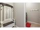 Hallway with built-in bench, mirror and hooks leads to the laundry room at 12027 S 183Rd Dr, Goodyear, AZ 85338