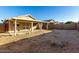 Spacious backyard with gravel landscaping and covered patio at 12034 W Aster Dr, El Mirage, AZ 85335
