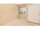Neutral bedroom with window, closet and tile floors provides a flexible space for personalization and comfort at 12034 W Aster Dr, El Mirage, AZ 85335