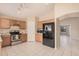 Spacious kitchen featuring stainless steel appliances, tile flooring, and plenty of cabinet space at 12034 W Aster Dr, El Mirage, AZ 85335