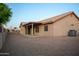 Expansive backyard with a covered patio, offering ample space for outdoor enjoyment at 1220 S Wagon Wheel Dr, Chandler, AZ 85286