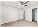 Bright bedroom with neutral carpet, bright walls, and a ceiling fan at 1220 S Wagon Wheel Dr, Chandler, AZ 85286