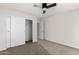 Bedroom featuring neutral carpet, bright walls, and a closet with sliding doors at 1220 S Wagon Wheel Dr, Chandler, AZ 85286