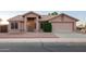 Charming single-story home featuring a neutral stucco exterior, tile roof, and well-maintained landscaping at 1220 S Wagon Wheel Dr, Chandler, AZ 85286