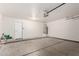 Spacious two-car garage featuring concrete floors and ample room for vehicles and storage at 1220 S Wagon Wheel Dr, Chandler, AZ 85286