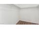A spacious walk-in closet with wood-look flooring and ample shelving for organized storage at 1220 S Wagon Wheel Dr, Chandler, AZ 85286