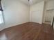 Spacious bedroom with stylish flooring, a ceiling fan and a closet with folding doors at 1248 W Deoni Trl, San Tan Valley, AZ 85143