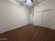 Empty bedroom featuring wood floors, neutral walls, and closet with folding doors at 1248 W Deoni Trl, San Tan Valley, AZ 85143