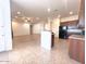 Kitchen island overlooks the living and dining areas at 1248 W Deoni Trl, San Tan Valley, AZ 85143