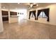 Bright living room featuring tile floors and large windows with modern curtains at 1248 W Deoni Trl, San Tan Valley, AZ 85143