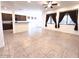 Open concept living room with tile flooring and natural light at 1248 W Deoni Trl, San Tan Valley, AZ 85143