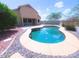 Backyard pool with a view of the home's rear exterior at 1248 W Deoni Trl, San Tan Valley, AZ 85143