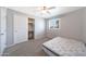 Comfortable bedroom with a ceiling fan, window, and closet with sliding doors at 12627 N 25Th Ave, Phoenix, AZ 85029