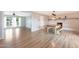 Open floorplan featuring hardwood floors, fireplace, dining and living room at 12627 N 25Th Ave, Phoenix, AZ 85029