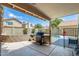 Backyard featuring covered patio, grill, pool and privacy wall at 1310 E Helena Dr, Phoenix, AZ 85022