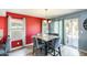 Cozy dining area with modern furniture, large window, and sliding glass door to the back yard at 1310 E Helena Dr, Phoenix, AZ 85022
