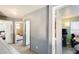Hallway offering entrances into bedrooms with twin beds and cozy decor, showcasing the home's layout at 1310 E Helena Dr, Phoenix, AZ 85022