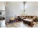 Spacious living room with soaring ceilings, lots of natural light, and wood-look floors at 1310 E Helena Dr, Phoenix, AZ 85022