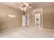 An inviting bedroom with neutral decor offers a peaceful space with easy access to a connected bathroom at 13213 W Jacobson Dr, Litchfield Park, AZ 85340