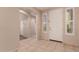 Welcoming foyer featuring tile floors, white trim and natural light at 13213 W Jacobson Dr, Litchfield Park, AZ 85340