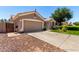 Charming single story home with two-car garage and well-manicured lawn at 13213 W Jacobson Dr, Litchfield Park, AZ 85340