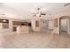 Open-concept living area with tile floors, breakfast bar and ample natural light at 13213 W Jacobson Dr, Litchfield Park, AZ 85340